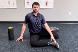 A man performs some mobility stretches as a part of a mobility routine offered by Apex Performance & Chiropractic.