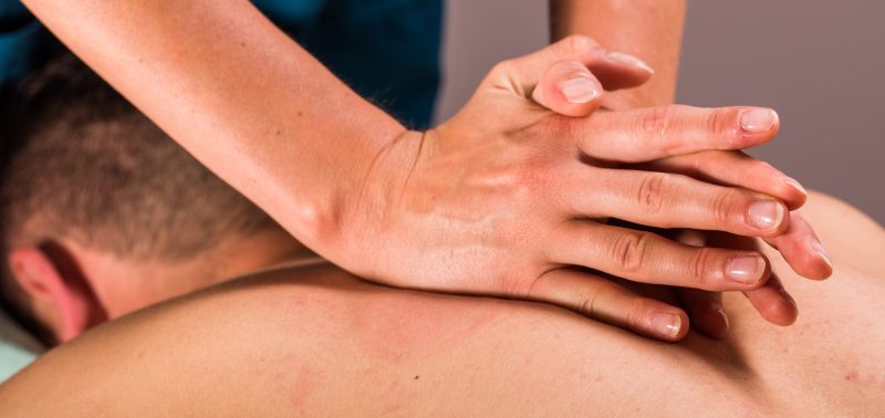 A person receives a deep tissue massage.